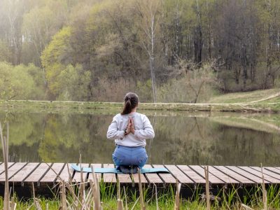 adult-woman-50-does-yoga-on-the-lake-shore-2023-11-27-05-07-07-utc